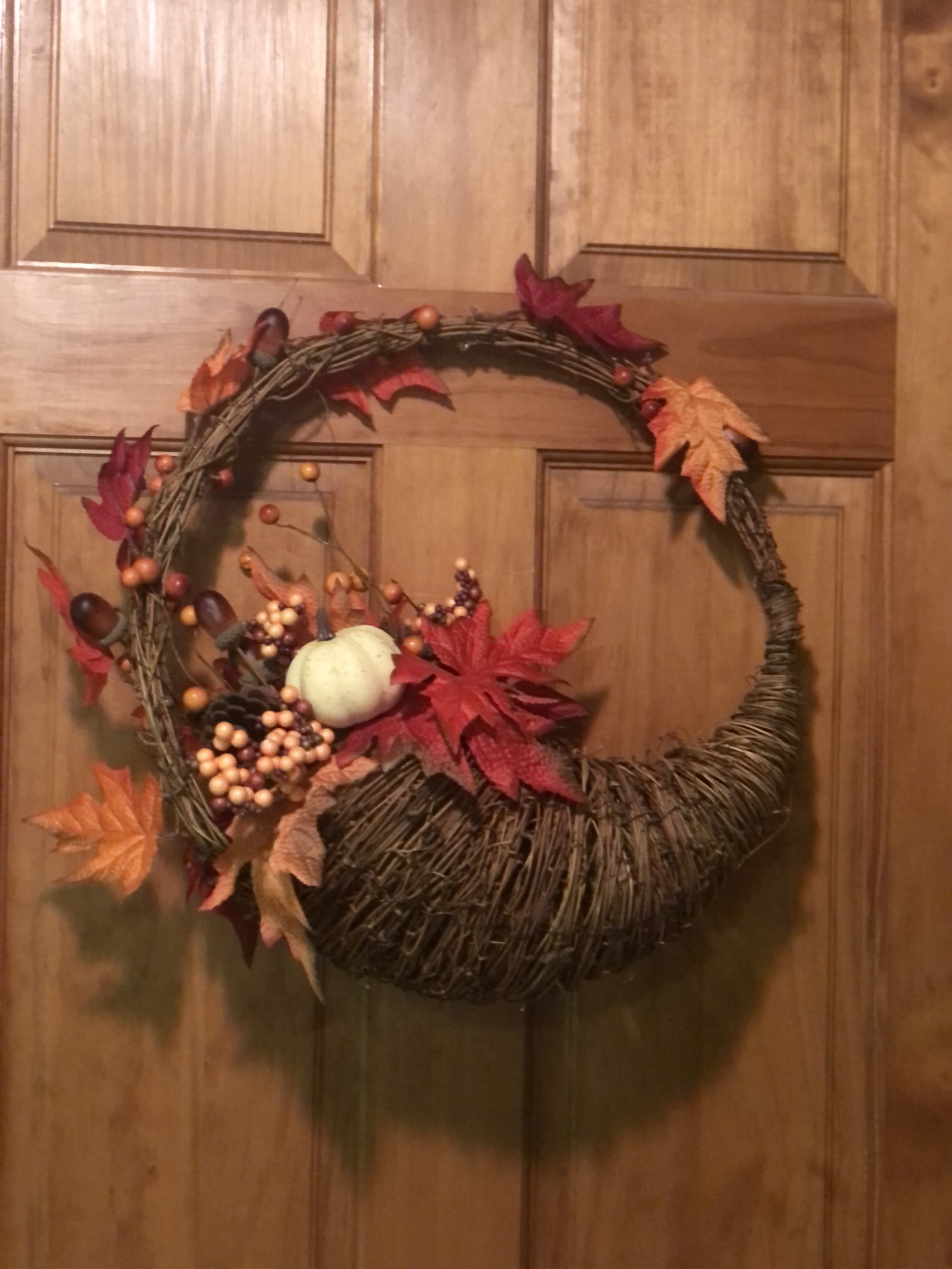 Shades of Fall Wreath - 15" Decorated Silk wreath with a cornucopia base with leaves, berries and 2 pumpkins (one on each side of the wreath) Great for a doorway, entryway or covered porch. Reusable every fall season. Sure to become a keepsake for whomever received it. ( only 1 left available.)