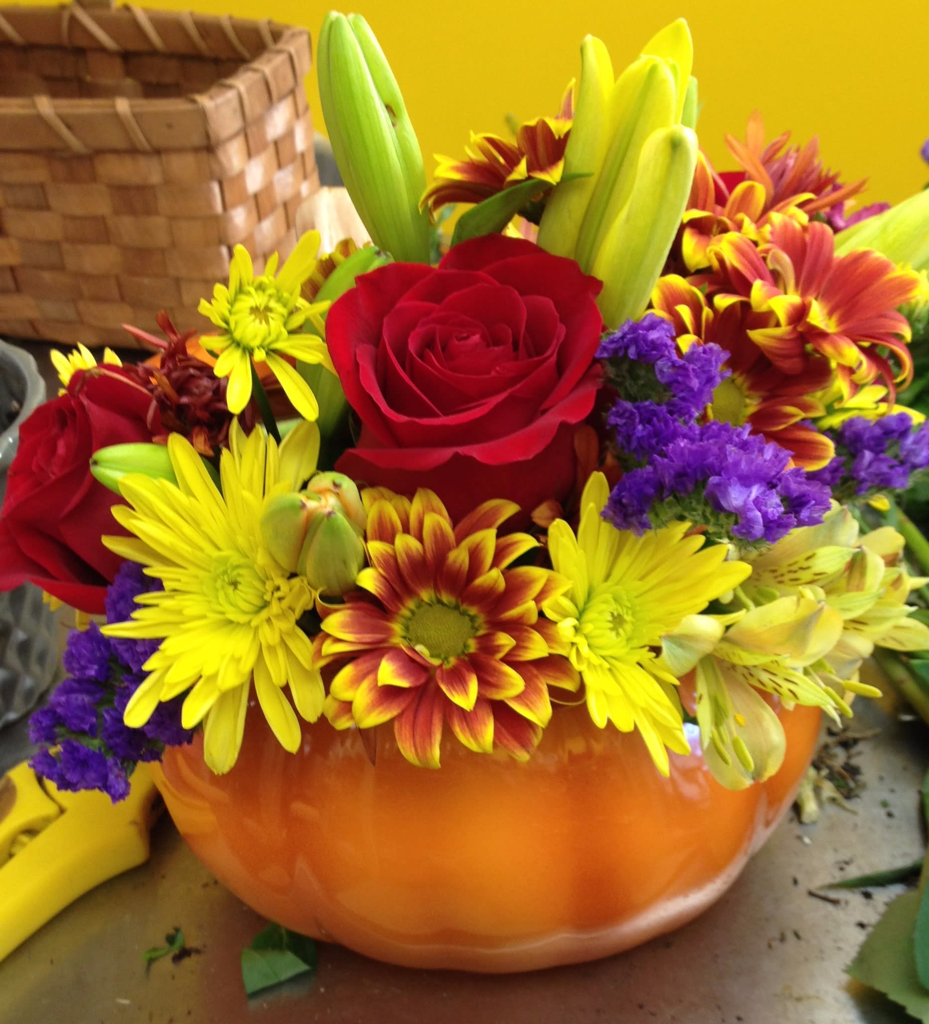 Festive Fall combo to include an assortment of roses, lilies, carnations, mums, alstro, gerbs, filler - The perfect amount of fall for anybody! The keepsake ceramic pumpkin will enlighten for the whole season! Artificial style available too, put 'silk' or 'artificial' in special instructions.