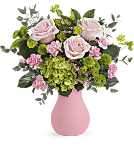 Pink roses and green hydrangeas in a pink vase