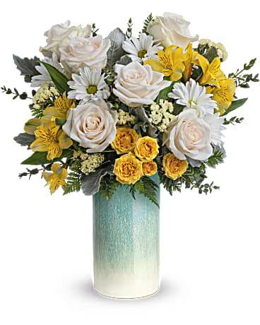 Bouquet of white roses, yellow flowers, and daisies in a teal vase