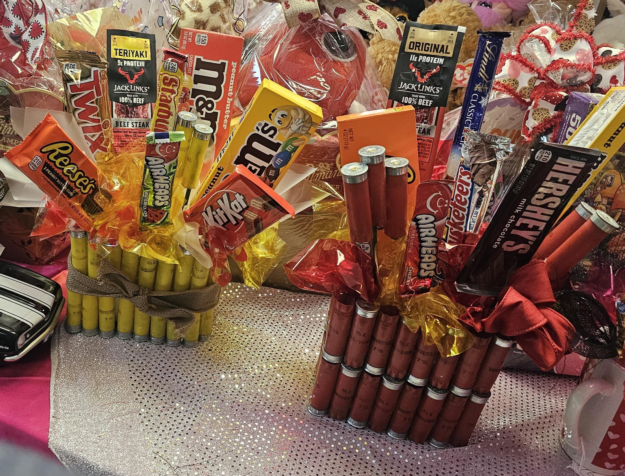 Gift bouquets made of candy bars and snack packs arranged in cellophane