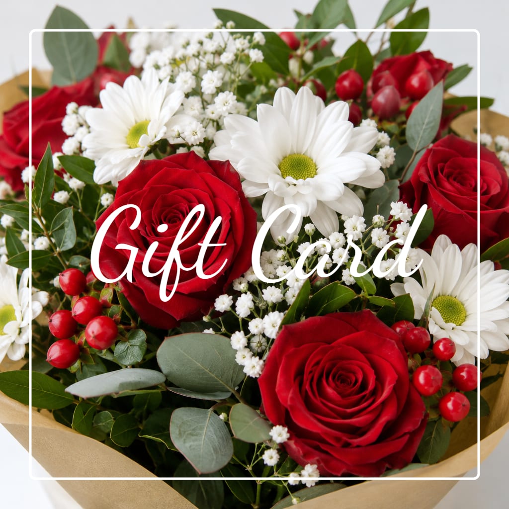 Gift card over a bouquet of red roses and white daisies