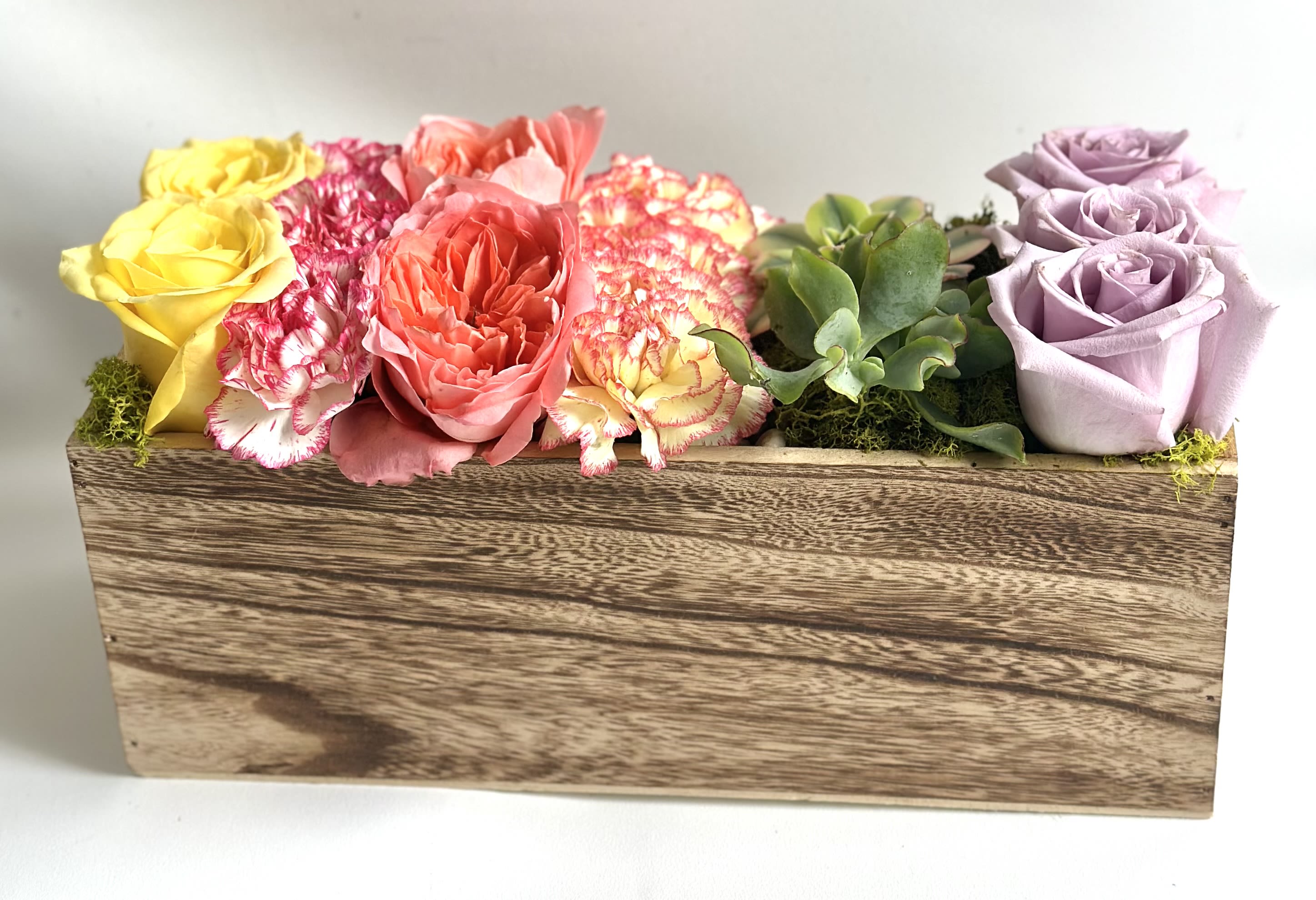 Painted Garden Row by Barb’s Flowers - This is really pretty—soft but playful, with that modern wood box giving it a clean, grounded feel. The mix of sunny yellow, coral, blush, and lavender with the succulent makes it feel like a curated “row garden.”