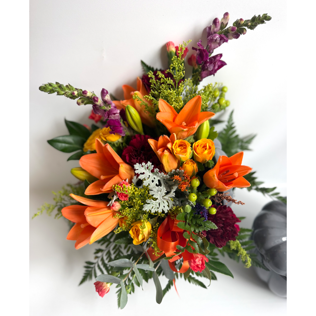 Bouquet with orange lilies, yellow roses, and purple snapdragons