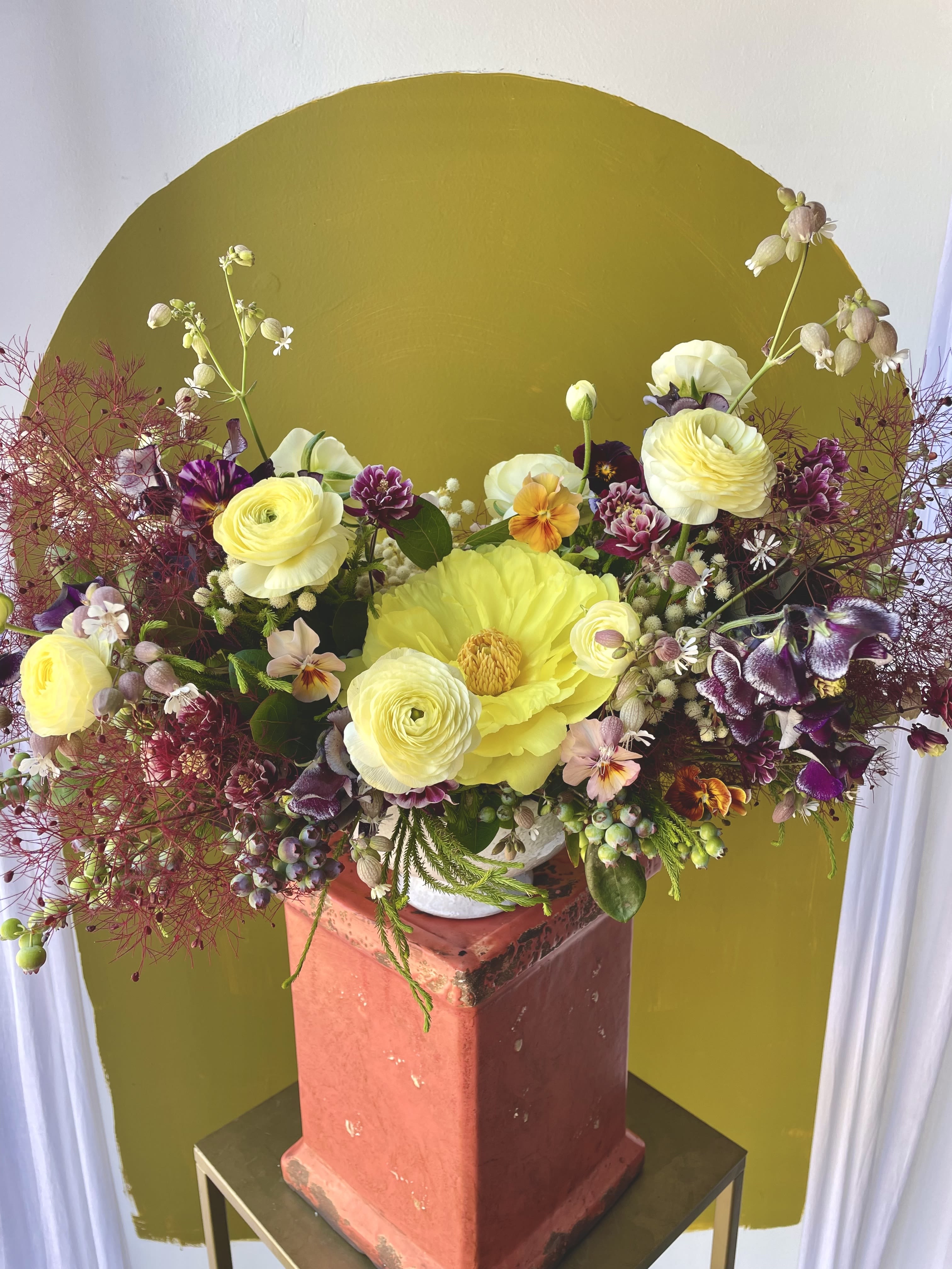 Seasonal Centerpiece Designers Choice  - This is our "Seasonal Centerpiece Designers Choice" arrangement.  Our centerpiece arrangements are designed with the intention of it being viewed from every angle.  Making it a perfect table arrangement for a formal dinner party, bridal brunch, or just because!  Our designers will craft you a unique arrangement adding our freshest blooms in a stunning color palette.   Ideally this arrangement would work best on a circular or rectangular table seating 3-6 people.   ** Concerning Seasonality **  As a seasonal, locally-focused florist, we have different product to work with each week. Our focus is on creating a unique piece for each customer, with blooms that are fresh from local farms and growers. While the flower varieties and colors may vary, the quality and freshness will always be the best. It is an honor to have our customers' trust and confidence in our abilities and artistic eye.   ** DELIVERY POLICY ** Pick-ups at the studio are available after 2pm. Our daily delivery time frame is typically between 12- 3 PM. Please specify if you require a certain delivery time and we will do our best to accommodate it, or we will call you if we cannot. Please include any gate codes if applicable! If there is no answer at the door, our delivery person will leave the flowers by the doorstep in a weather safe location or contact you to reschedule the delivery.  Completing your order acknowledges that you have read and understand our delivery policies. 