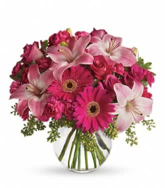 Pink bouquet with lilies, gerbera daisies, and roses in a glass vase