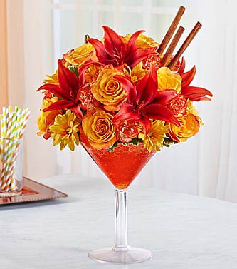 Pumpkin Spice - Raise a toast to the special people who touch your heart with our popular cocktail creation! The season’s most savory spices—cinnamon, nutmeg, cloves and pumpkin, of course—are captured in each rich red, orange and bronze bloom. We’ve gathered them all inside an oversized martini glass so that you can share the beauty and color of autumn, along with your warmest sentiments.