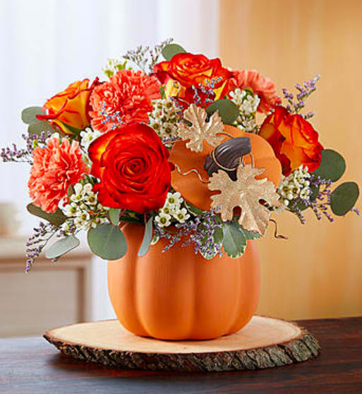 Pumpkin Petals  - Send joyful autumn smiles with a gift that’s simply gourd-geous! Our stunning display of seasonal orange and white blooms arrives inside our artful ceramic pumpkin container complete with lid and glittering gold, metallic leaf accents. It’s a festive gift that can later be used to hold holiday treats, or simply to add a delightful touch of fall décor. Product Code: 167666
