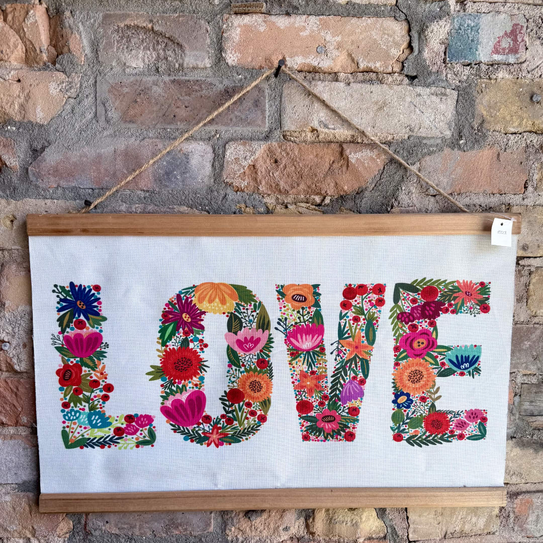 Framed wall sign with the word LOVE in floral letters