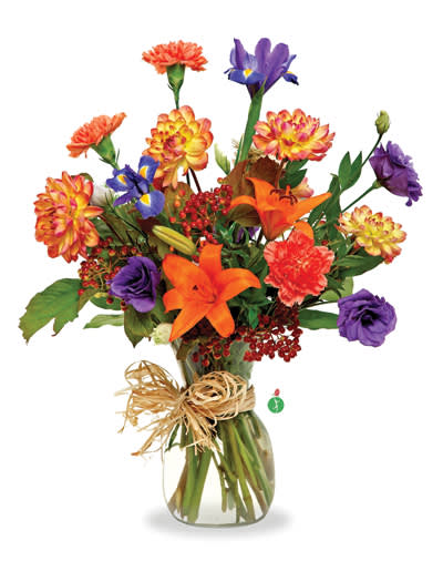 Mixed bouquet of orange, purple, and yellow flowers in a glass vase