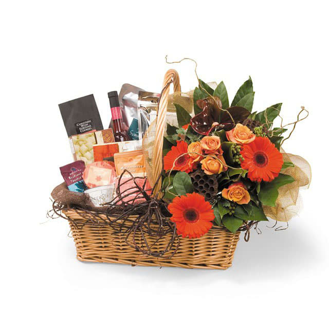 Welcoming Summer Basket By Flower Carriage - Celebrate summer with this gift basket and floral arrangement.  Includes: crackers, candies, cheese, almonds and cashews next to a floral bouquet welcoming the Summer time with colors . NOTE: no alcohol included.