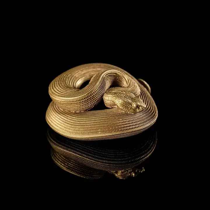 Viper Bottle Opener - Viper Snake Bottle Opener  About  This bottle opener is modeled after the mighty viper. A venomous snake with a triangular head. We portrayed it curled up and waiting patiently, whether for a meal or your bottle, who knows! As a pure brass bottle opener, it fits well in the hand and feels sturdy to use.  Vipers have what is called keeled scales. It means that instead of being smooth like the scales of some other snakes, the viper scales have a ridge down the center that adds texture. People think this might be what it feels like to touch a dragon scale. It's thought that the keeled scales reduce the shininess and glare that can come from flat scales.
