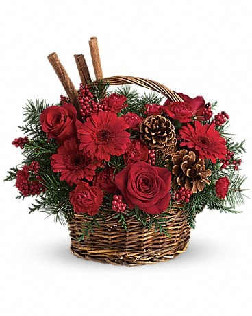 Berries And Spice - Berries and spice and everything nice make this beautiful flower arrangement a wonderful holiday gift. Festive red roses, gerberas, carnations and berries are arranged to look their holiday best when mixed with cinnamon sticks and pinecones in a lovely wicker basket. It's a great way to get a handle on your holiday gift list!