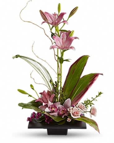 Tall pink lily arrangement in a black rectangular vase