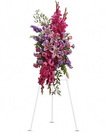Touching Tribute Spray - Express admiration for her beauty and spirit with a striking tribute certain to evoke many cherished remembrances. Gorgeous flowers such as pink roses, oriental lilies and gladioli blend with purple stock, lavender carnations and fragrant greens.