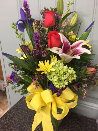 spring arrangement - bright and colorful roses tulips iris lilies