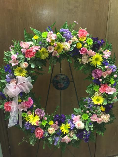 spring wreath - colorful wreath  with roses, daisy, carnation, statice, button poms, and asst greens 