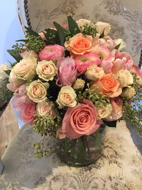 Good Day Sunshine  - Sherbert colored roses, ranunculus and tulips.  Full and lush.  Vase measures 8"x6".  Flowers may be substituted depending on availability.