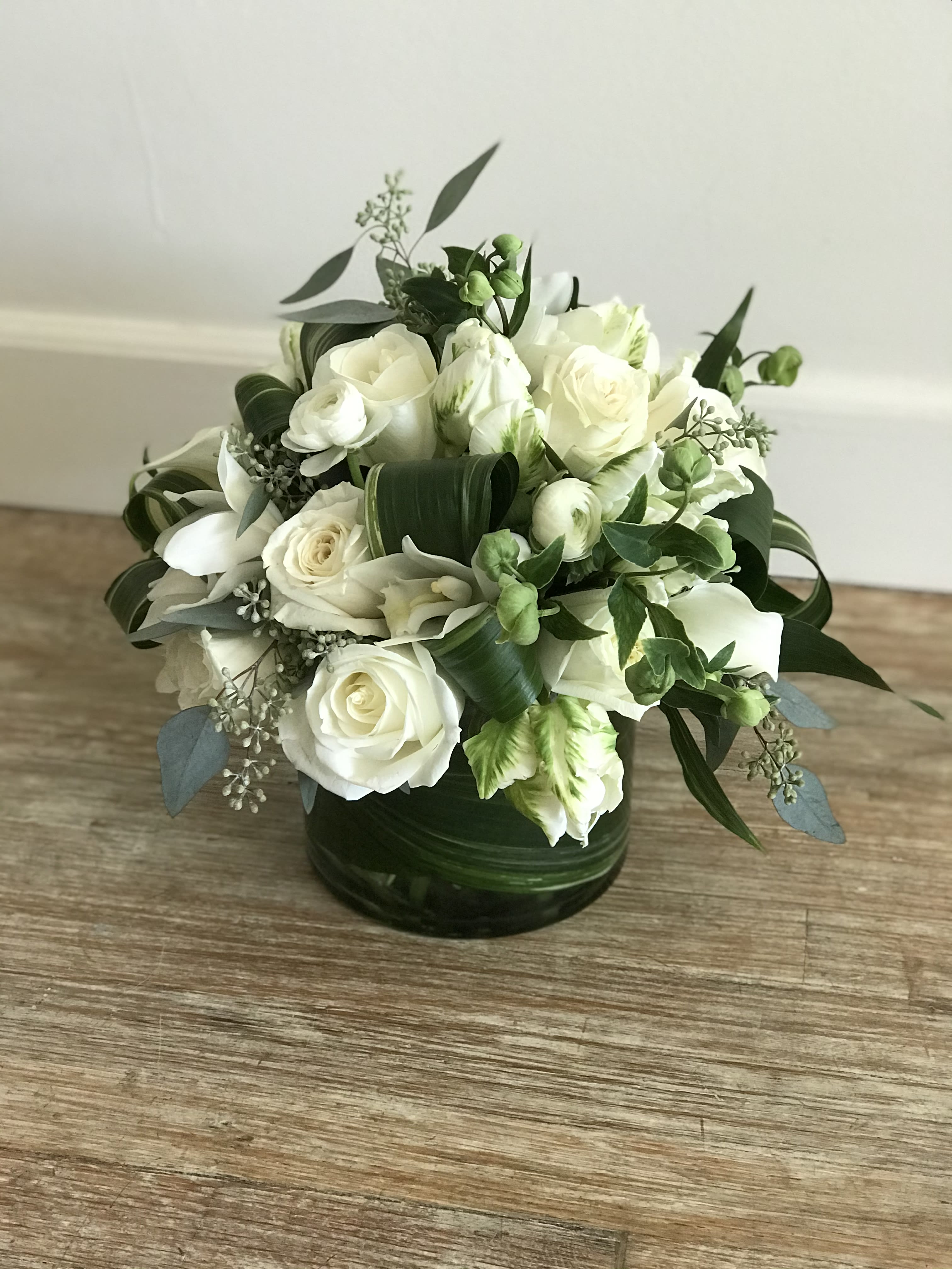 Across The Universe  - A classic look.  Lovely whites and greens will make any occasion special.  Seasonal flowers used so some may be substituted depending on availability.  