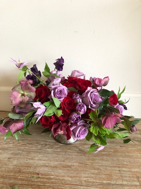 In the Mood - A Beautiful mix of flowers in a deeper, richer color tone. Perfect for your Valentine. Colors as well as flowers may be substituted due to availability.