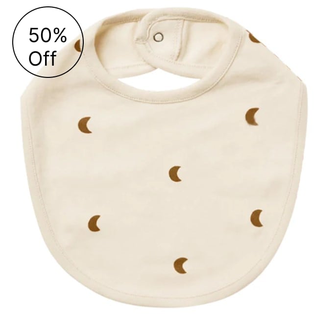 Cream baby bib with brown crescent moon pattern