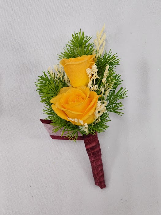 Sweet Nectarine Boutonniere   - Select this orange spray rose boutonniere with accents of bleached misty and burgundy ribbon. Each boutonniere comes with two metal pins to pin on a jacket lapel or shirt.  Exact flowers may vary.