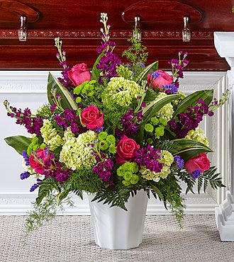 Gentle Horizons Floor Basket - Blessings and prayers sent from above are captured in this stunning lavender and white arrangement. Each gorgeous bloom in FTDs' Heaven Sent Floor Basket is designed to bring solace during difficult times. While the lilies may initially arrive in bud form, they beautifully transform as they open. Exact container may vary. FTD S5281s  To allow for the freshest blooms, we may substitute for a different variety, color or flower.