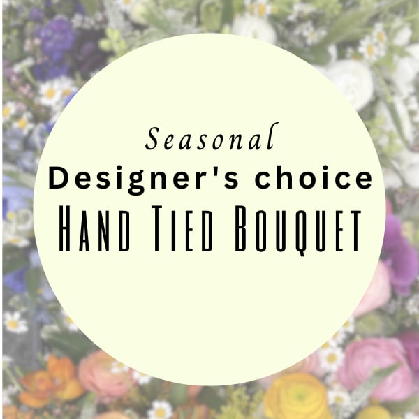 Designers Choice Handtied Bouquet - Designer’s Choice Cello Wrap is a hand-tied bouquet designed in a gathered style and wrapped in cello selected by our designers to best complement the finished arrangement. This item does not include a vase and is ready to be placed into your own. Each bouquet features seasonal flowers chosen by our team based on availability and creative vision. To ensure freshness for a few hours, the stems will be secured with a wet sponge or water tubes. While the final design is left to our designers, we are happy to take a few preferences or ideas into consideration and will do our best to accommodate whenever possible.