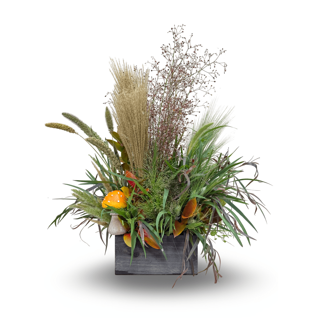Tall mixed arrangement with grasses and orange calla lilies in a dark wooden box