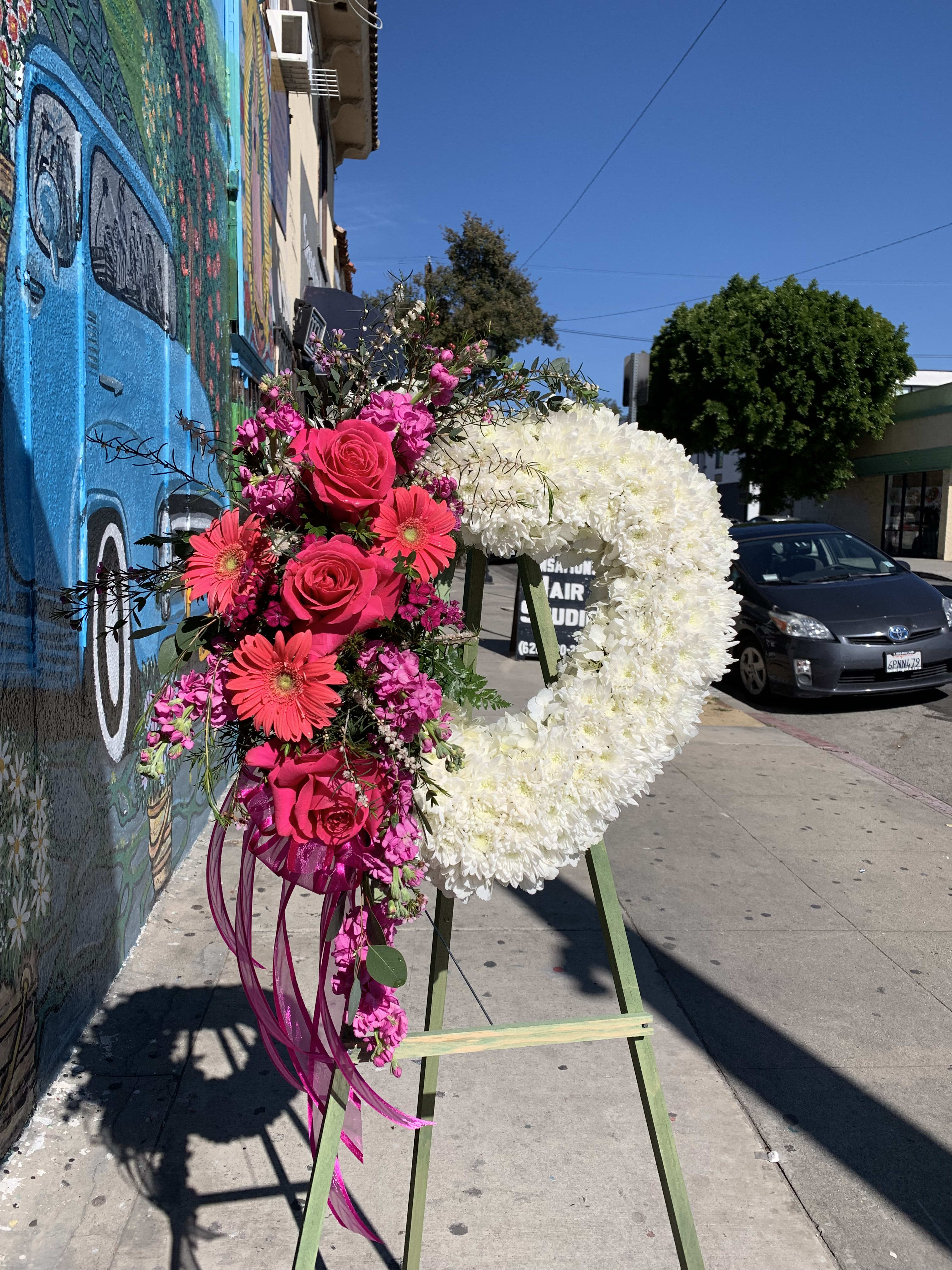 Forever Loved - Heart shaped spray with flowers arranged on the side.   *Order must be placed 2 - 3 days in advance* (Please note, same day pick-up or delivery is not available for this product) 