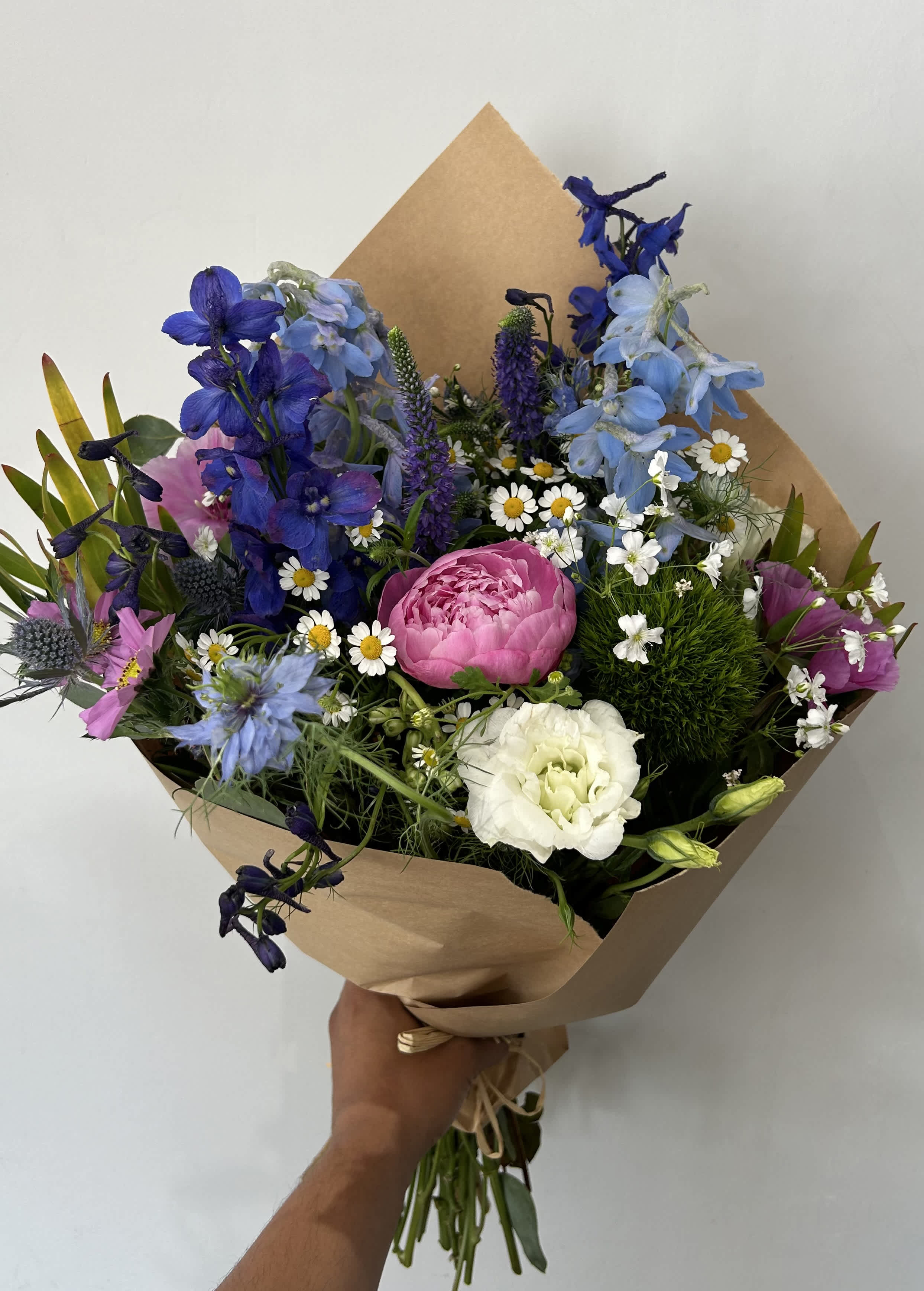 Wild Peony  - Seasonal wild flowers with a peony wrapped into a bouquet. 