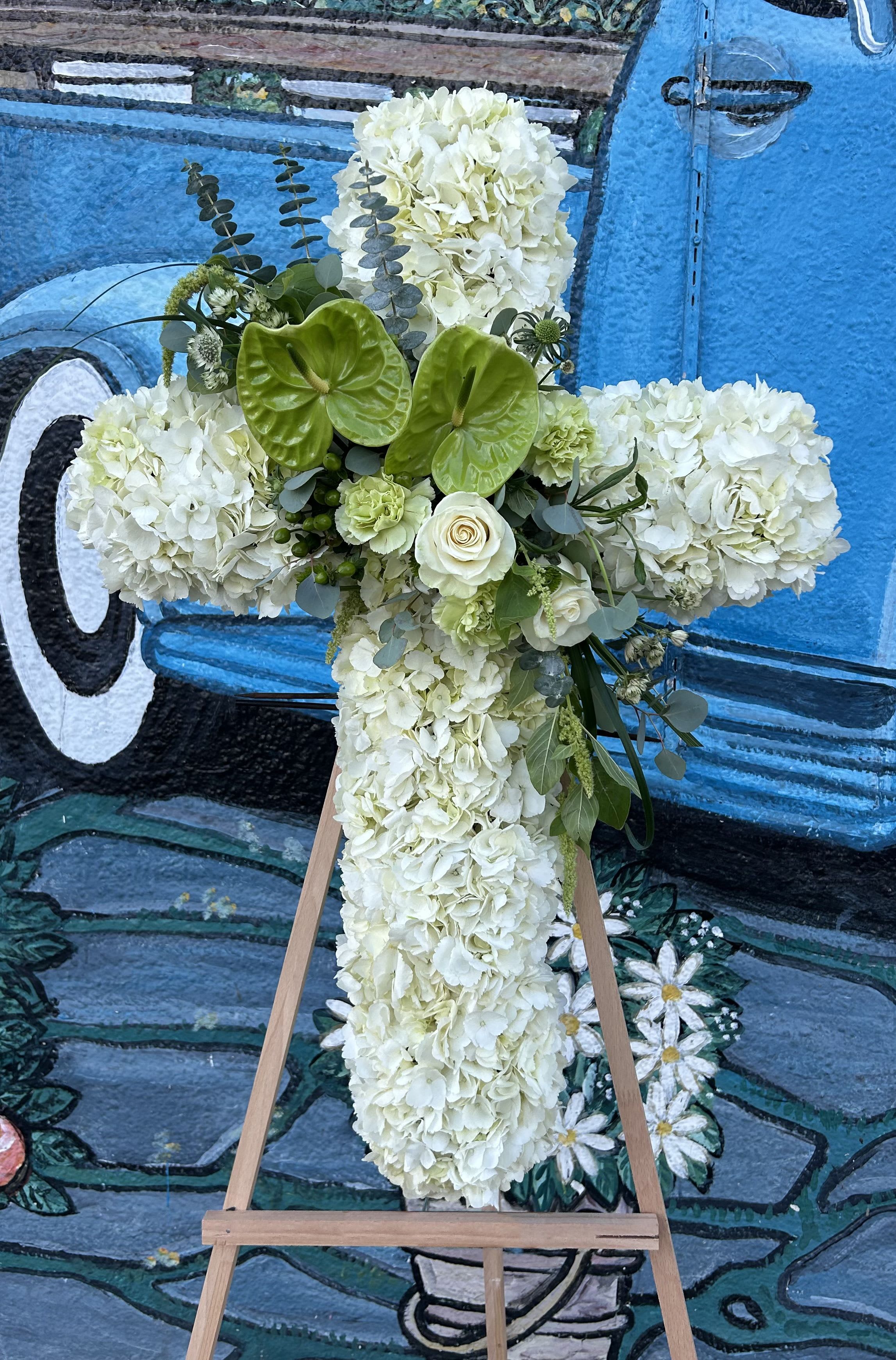 Pasture Cross - Seasonal white and green flowers arranged into a cross spray.