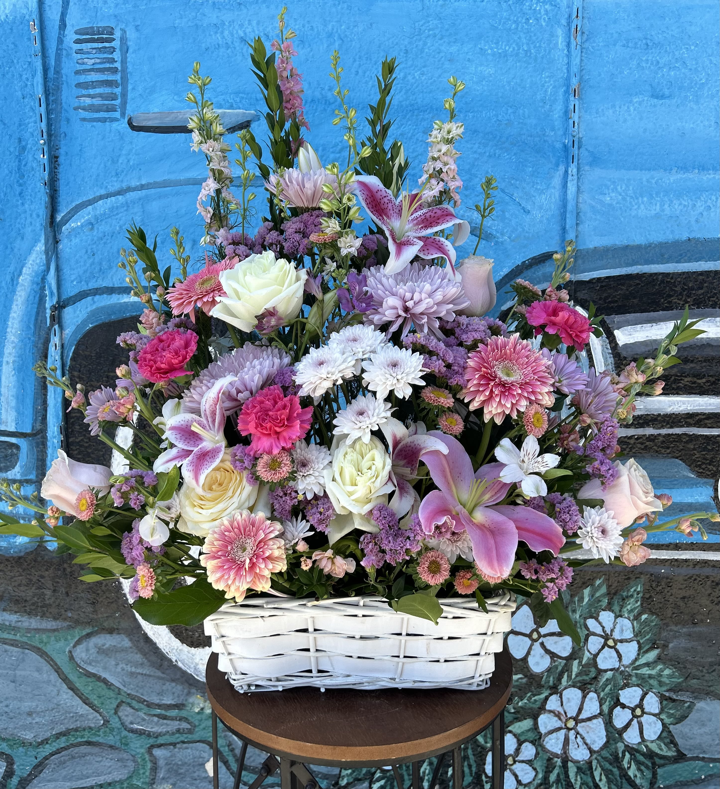 Pastel Basket - Seasonal pastel flowers arranged into a basket. 