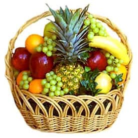Fruit basket with pineapple, bananas, apples, grapes, and oranges