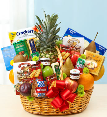 Gift basket with fruit, snacks, and a pineapple centerpiece
