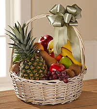 Fruit basket with pineapple, bananas, apples, grapes, and kiwi