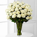 Bouquet of white roses in a clear glass vase