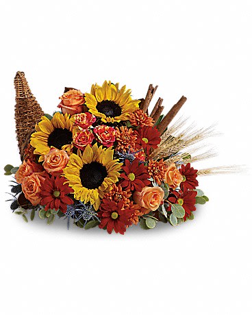Autumn floral arrangement with sunflowers, roses, and daisies