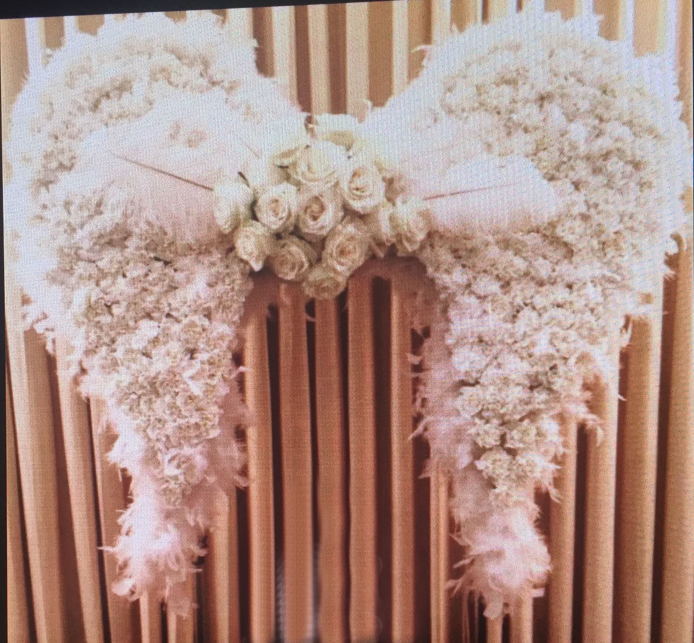 White floral casket spray with roses and cascading blooms