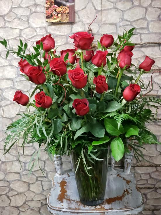 Queen's Heart - Only when supplies available on holiday weeks the inventory will be limited at times. Reserve ahead of holiday's. Similar vase of two dozen red roses &amp; greenery,  provides the classic romantic gift on Valentines!.  It's perfect for any celebration or holiday!  .  Vase style will and can vary.  Deluxe &amp; Premium will have more filler and mixed florals added. Upgraded vase at times will be chosen to offset the full value. Sample STANDARD design theme in photo. 