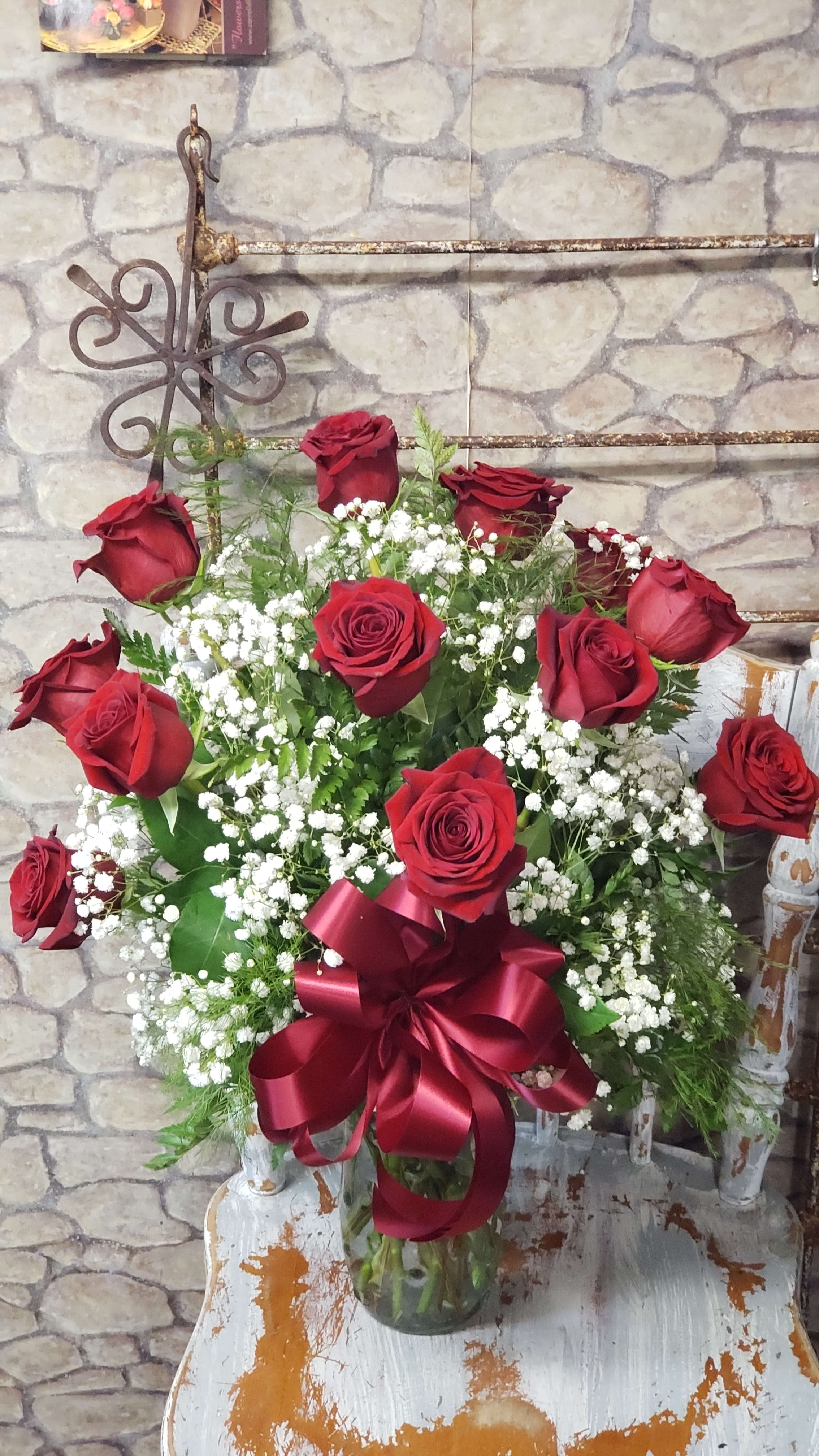 Queen Of Hearts - Plan ahead! Order ahead of holiday week demands. Usually we'll stocked tho! For any occasion &amp; holiday's this is available.  OR "Just Because" One dozen 50 CM (smaller heads) Rose's designed in a clear vase with snowy white babies breath &amp; hand-made bow.  At times Babies Breath (Gyp) is limited.  Vases will vary in style &amp; color. High petal count Ecuadorian Freedom roses are usually stocked!  Sample photo for overall theme of design. WOULD BE SIMILAR IN STYLE!  Standard in sample photo.  Sizes of roses can vary if placing order late in holiday week or same day delivery! Could run out during demanding holiday weeks.  DELUXE: would have additional flowers, novelty holiday decor  added during holiday occasions &amp; handmade bow! PREMIUM: would have additional flowers within the dozen red Rose's AND additional Roses of red, white, Variety of pink tones (lavender is limited) Depending on market availability and overall design enhancement of floral selection. 