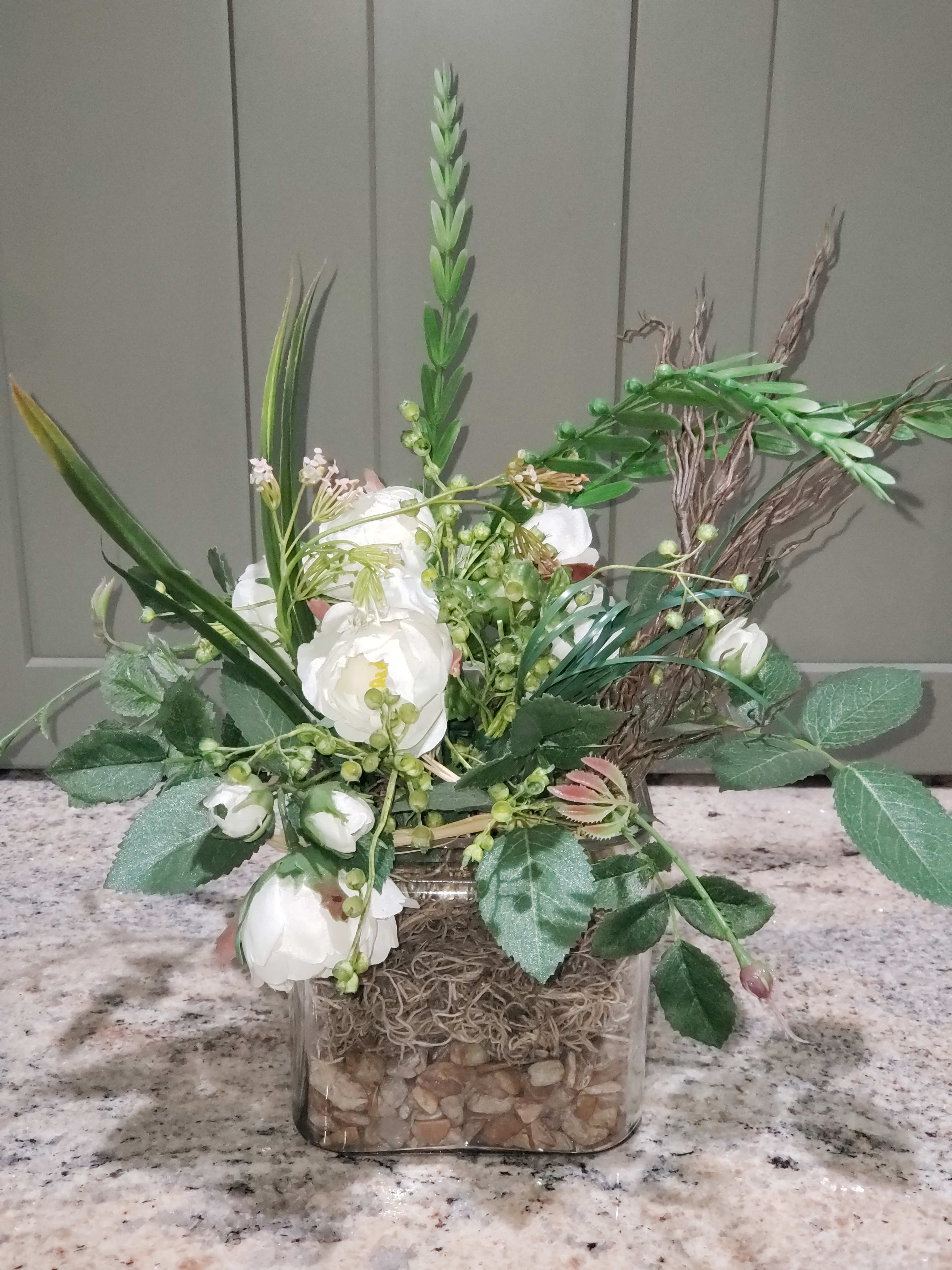 Faux Botanical Keepsake - NOT FRESH FLOWERS! This Keepsake will compliment any decor with its unique contemporary garden design.  NO water needed!! Maybe a dusting here n there.  Nice gift for any occasion or location.