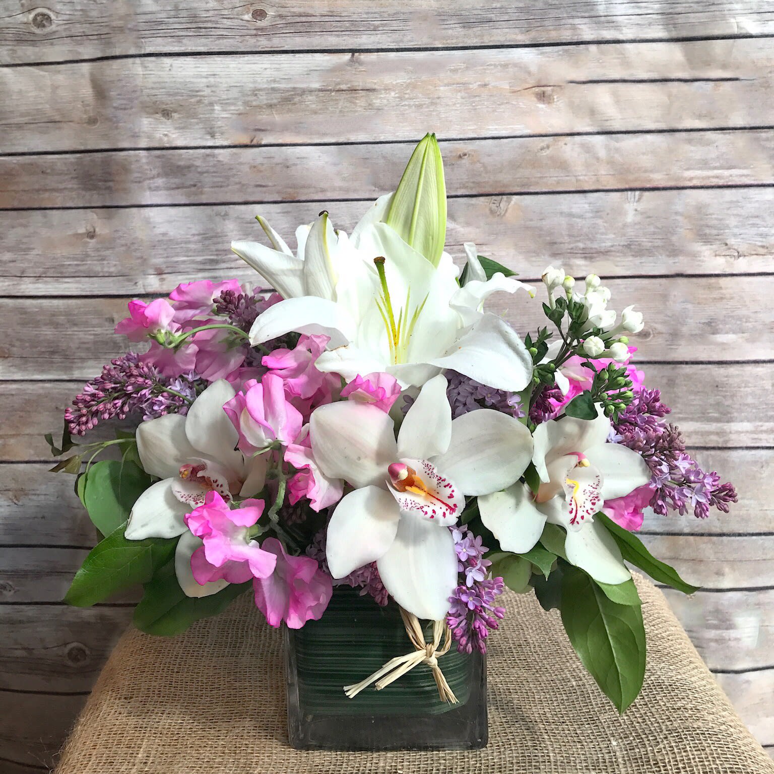 OMG ! - FRAGRANT AND SHOW STOPPING MIX OF WHITE CASA BLANCA LILIES, WHITE BOUVARIA, PINK JAPANESE SWEET PEAS, AND LAVENDER LILAC.   