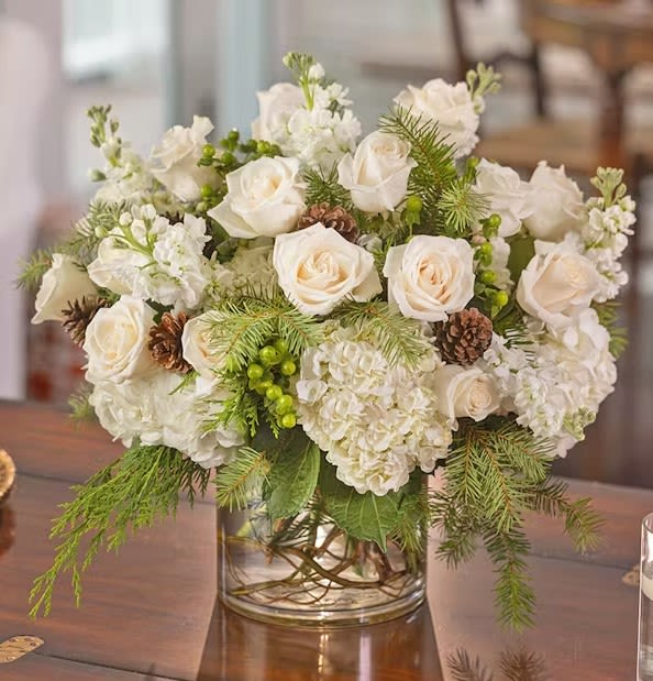 Snow White - White roses and stock and scented winter cedars nestled in a snowy bed of southern hydrangea.