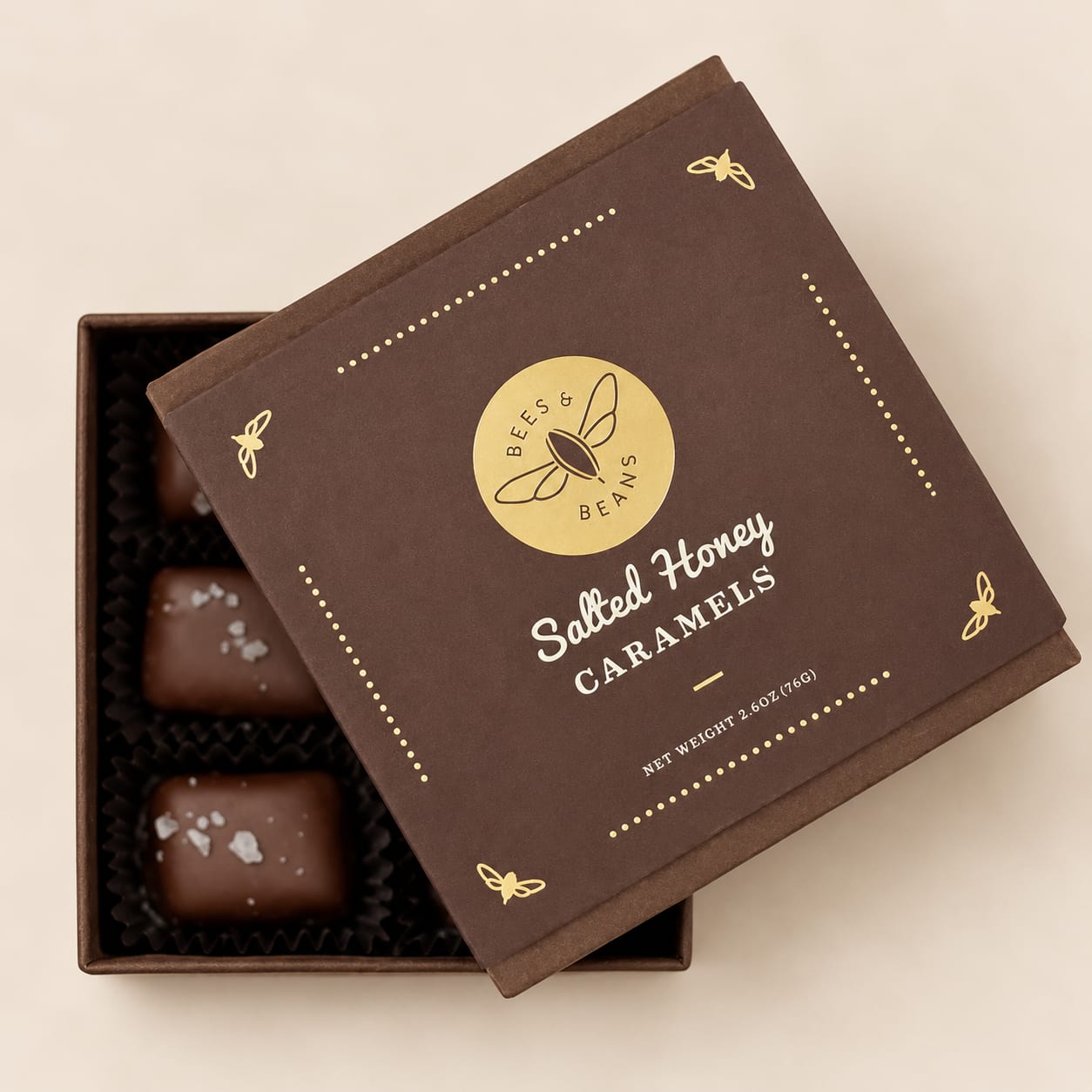 Box of salted honey caramels with two pieces visible