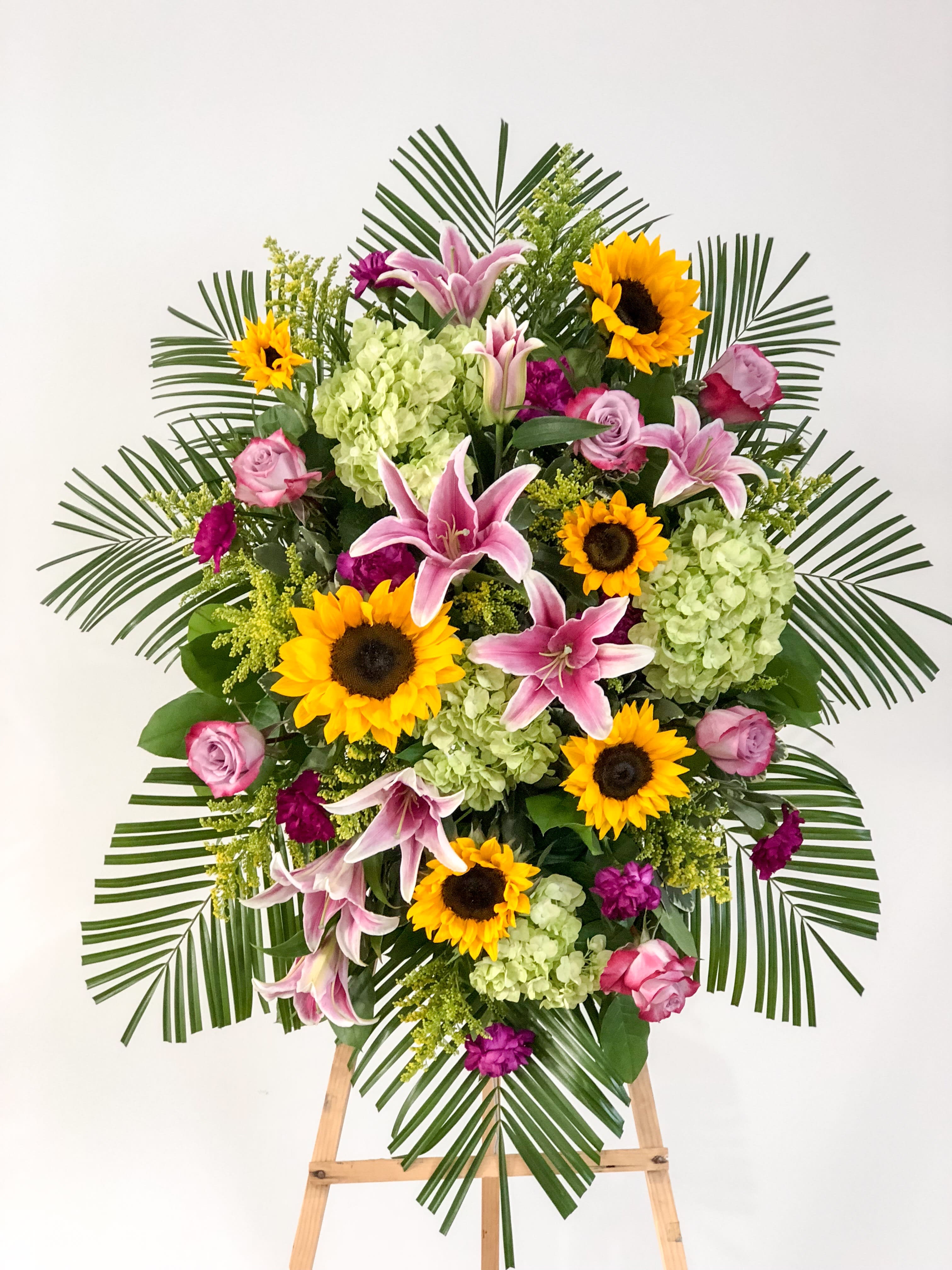 Cheerful Remembrance - A bright and beautifully scented standing spray to remember and celebrate the life of a loved one.   (approximately 48"H x 36"W)