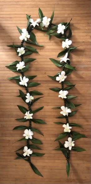 Double Ti leaf lei with orchid blooms - This braided ti leaf lei with white orchid blooms is a great gift of love for any occasion.  It is popular for weddings, baby showers, birthdays and graduations. It is also popular to embellish a sign for the big day, as a garland for a narrow table or to drape around a loved one's photo.  