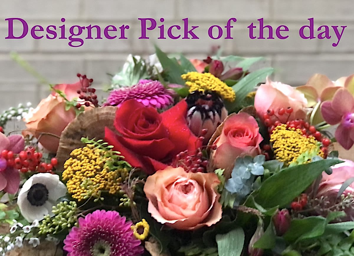 Designer Pick of the Day arrangement - Seasonal collection made on order with the freshest blooms available. The flowers in the picture are just a representation of fresh blossoms and do not represent the specific collection of the day. Available in Small, Medium and Large ( large can be requested in tall style- please note in your special instructions).