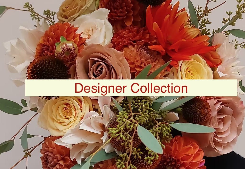 Bouquet of orange, cream, and blush flowers with greenery