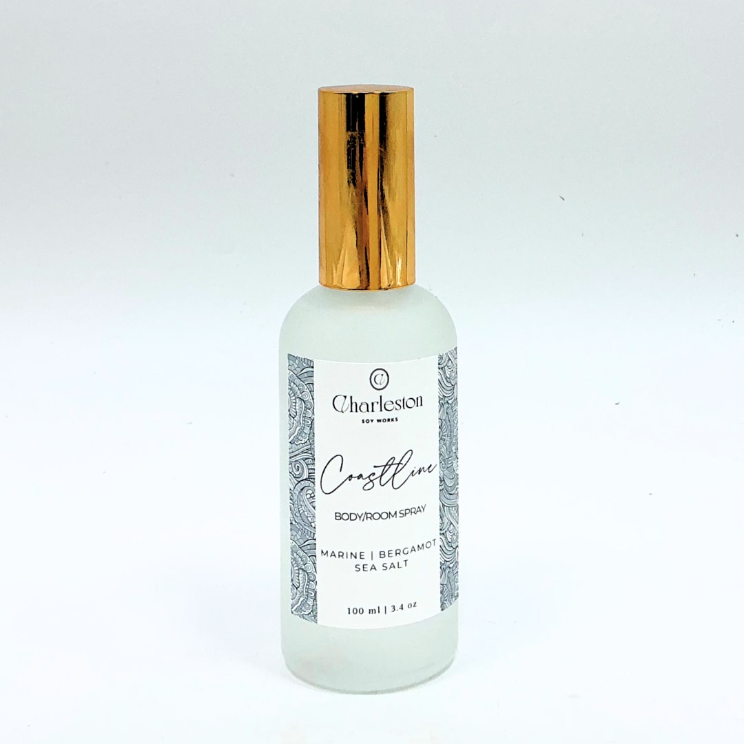 Bottle of Charleston Coastline body and room spray with a gold cap